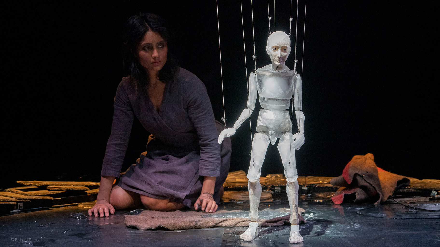 A performer and the ice puppet in Anywhere
